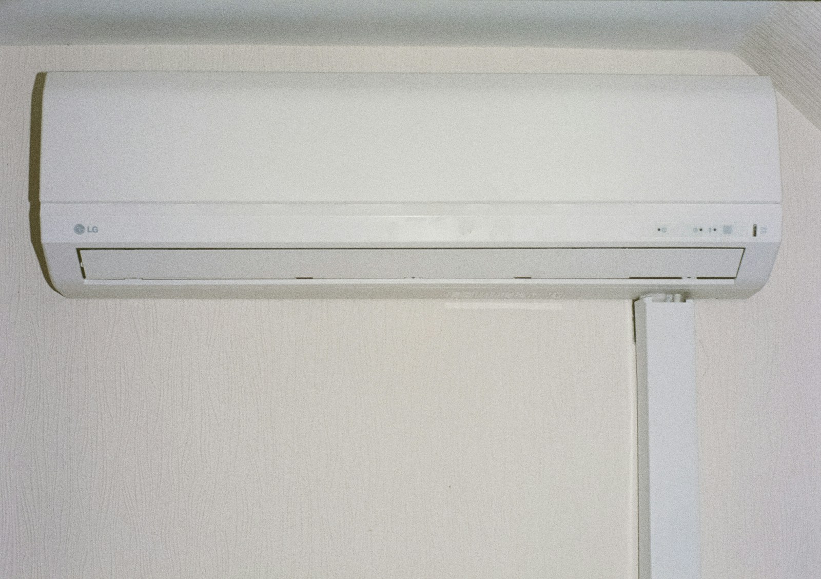 A wall-mounted air conditioner in an indoor space