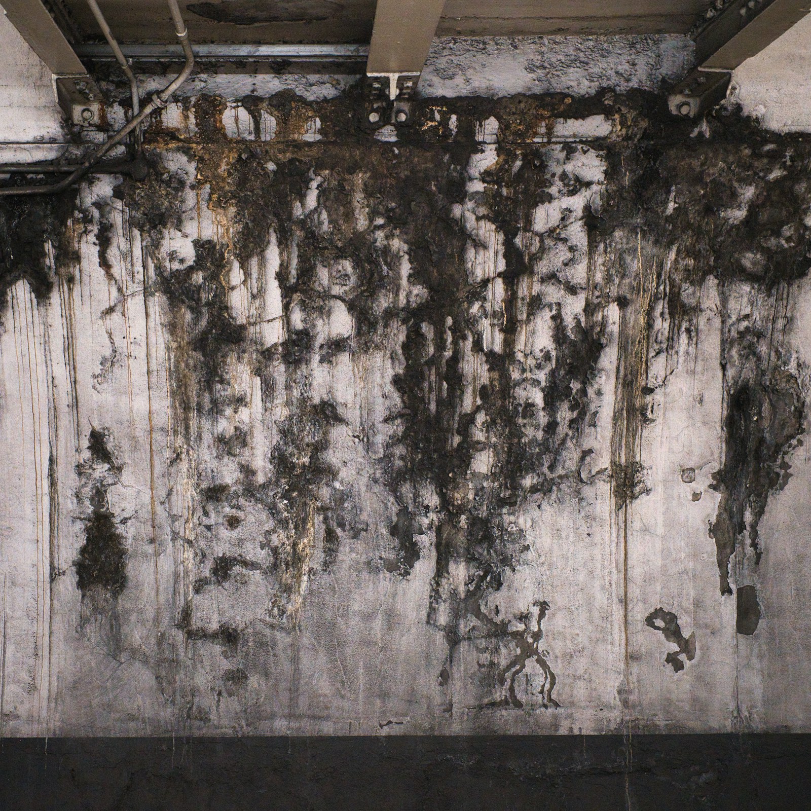 Water staining on an interior concrete wall